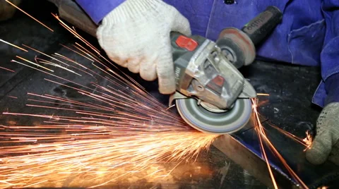 Close up shot worker with grinder grinds metall with sparks Stock Footage 67094049