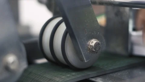 Close shot of worker hands putting labels on labeling machine line Stock Footage 119286564