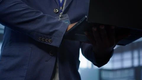 Close up shot of worker looking for data center network issues using laptop Stock Photos