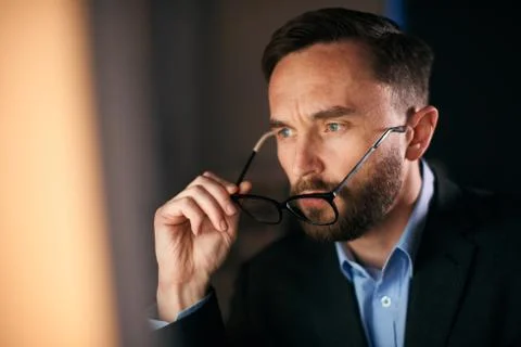 Close up shot of a worker looking directly at the computer screen Stock Photos