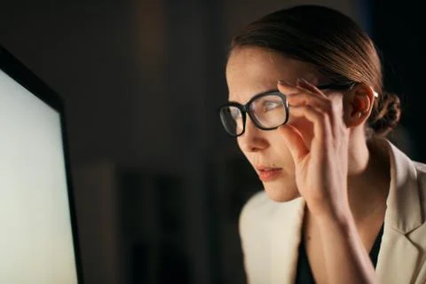 Close up shot of a worker looking directly at the computer screen Stock Photos