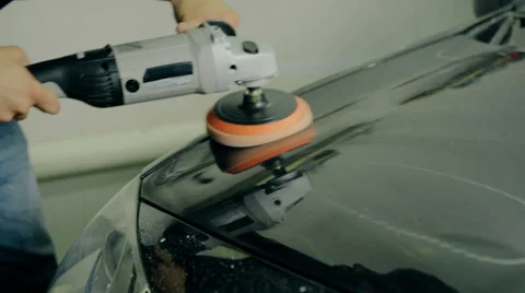 Close up shot Worker polish black car with special tools Stock Footage 65759077