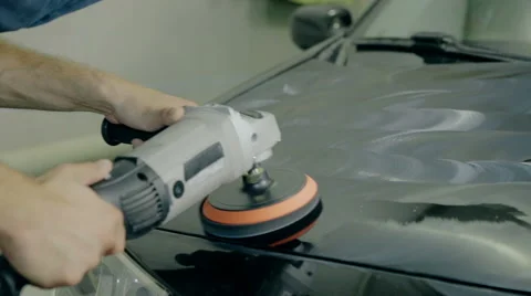Close up shot Worker polish black car with special tools Stock Footage 65759944