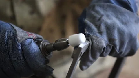 Close up shot of worker sharping a casting part. Industrial safety first Stock Footage 297194620