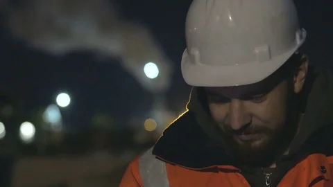 Close up shot of worker using smartphone in the twilight. Night shift concept.4k Video stock 83761510