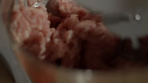 Close up shot of working mixer machine. It is mixing a mincing raw meat. Video stock 92925638