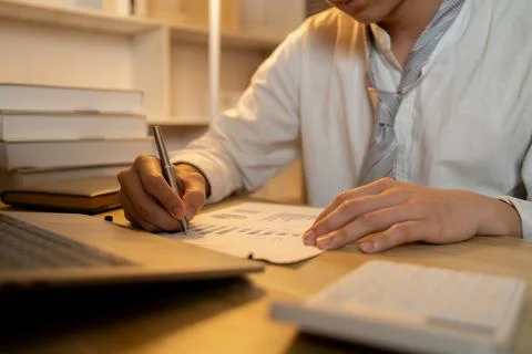 Close-up shot of writing important notes in a notebook, Working in the middle Stock Photos