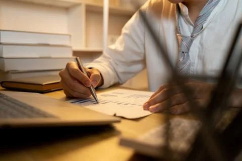 Close-up shot of writing important notes in a notebook, Working in the middle 스톡 사진