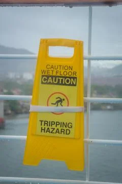 Close up shot of a yellow caution on floor Stock Photos