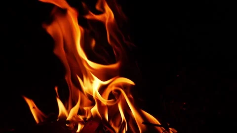 Close shot of yellow fire flames with black background Stock Footage 150715113