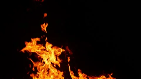 Close shot of yellow fire flames with black background Stock Footage 150715409