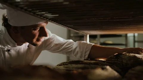 Close up shot of young baker standing in his bakery in the morning and sorting 動画素材 81116687