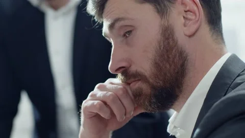 Close-up shot of young handsome pensive Caucasian bearded man at business Stock Footage 189035840