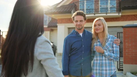 Close up shot of young happycouple getting a key to their new home from their Stock Footage 78239577