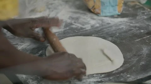 Close-Up Shot of A Young Lady Rolling a Dough Video stock 243683619