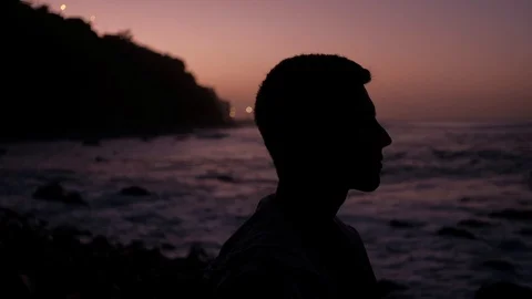 Close up shot of young man head silhouette on last minutes of sunset before dusk Stock Footage 123688501
