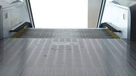 Close-up shot of young man Walk down the escalator Video stock 77628416