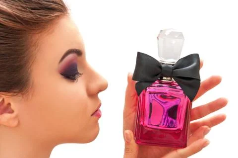 Close up shot of the young model with professional make up looking at pink bo Stock-Fotos