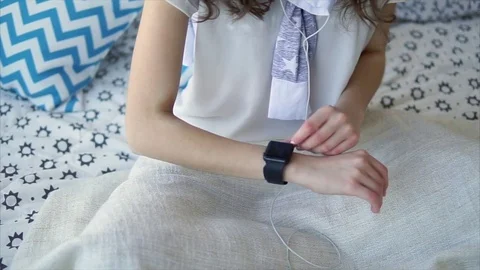 Close up shot of a young woman's hand, who checks messages on a smart watch. Stock Footage 74217093