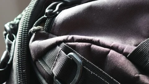 Close-up shot of a zipper on a backpack, great for travel or outdoor themes Stock Footage 322535953