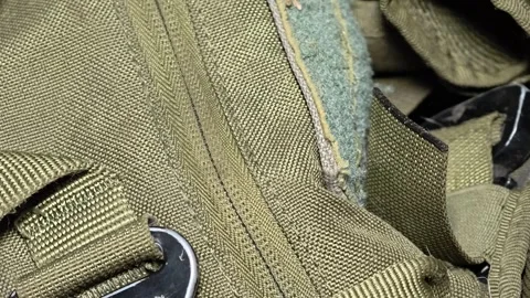 A close-up shot of a zipper on a backpack, suitable for use in travel, adve.. Video stock 347447934