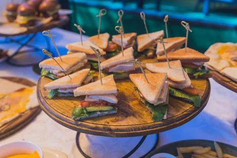 Close up shots of assorted sandwich triangles on a catering party platter. 스톡 사진