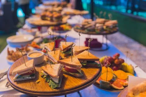 Close up shots of assorted sandwich triangles on a catering party platter. 스톡 사진