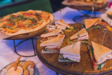 Close up shots of assorted sandwich triangles on a catering party platter. 스톡 사진