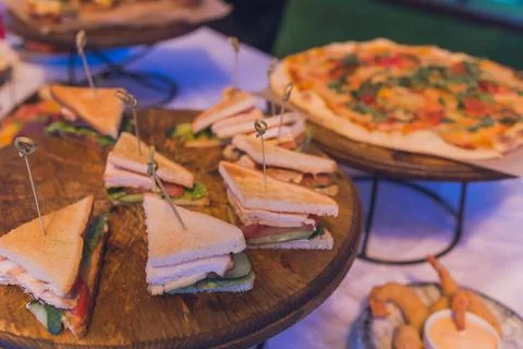 Close up shots of assorted sandwich triangles on a catering party platter. Stock Photos