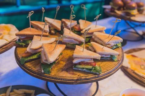 Close up shots of assorted sandwich triangles on a catering party platter. 스톡 사진