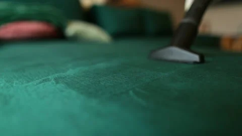 Close-up shots of cleaning the sofa with a vacuum cleaner. Stock Footage 237839956