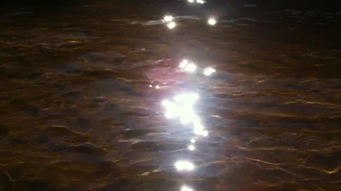 Close shots of freshwater with light reflex near a riverbank Stock Footage 276200470