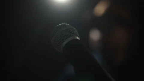 Close up shots of microphone singer man singing music and playing guitar. Stock Footage 241092397