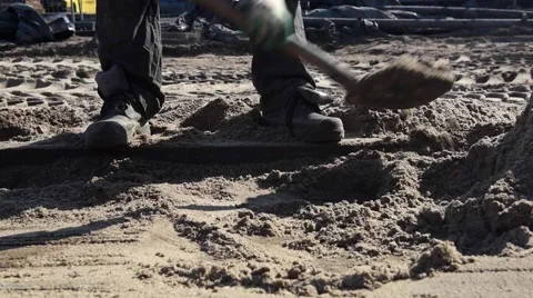 Close-up shoveling sand Video stock 62197940