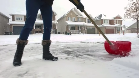 Close Up on Shovelling Snow Stock-Footage 70563295