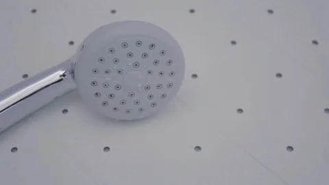 Close up of shower head turning on Stock Footage 118595947