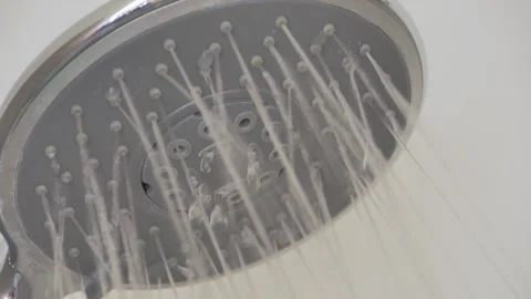 Close up Shower head with Water Drops Splashing out and Running from Faucet in Stock Footage 251050190