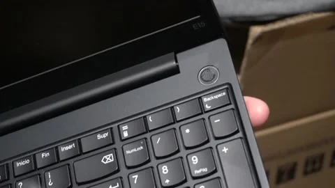 Close-up showing the fingerprint reader of a recently purchased new laptop Stock Footage 157995089