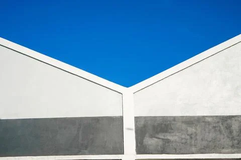 Close-up showing a symmetrical geometric pattern formed by two white gabled.. Stock Photos