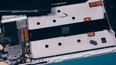 Close-up shows a disassembled smartphone Stock Footage 101343179