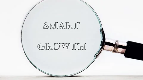 Close up shows a magnifying glass clarifying illegible text into the clear words Stock Footage 335079575