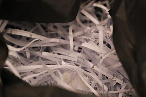 Close-Up of Shredded Paper Inside a Bag, Recycling and Document Security Stockfoto's