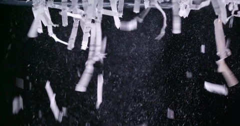 Close up of shredded paper leaving shredder against black Vídeo Stock 123730077
