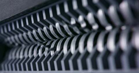 Close up of shredder jaws turning narrow depth of field close up macro Stock Footage 123730042