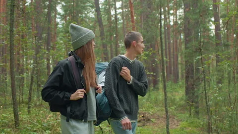 Close Up Of Siblings Adjusting Bags While Walking Through Forest Trail Видео 310467606