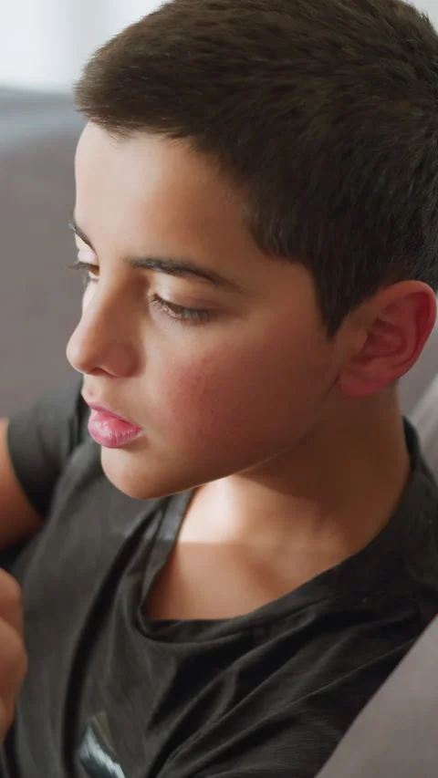 Close Up of Sick Boy Collecting Tea from Hand of Caregiver Stock Footage 320362952