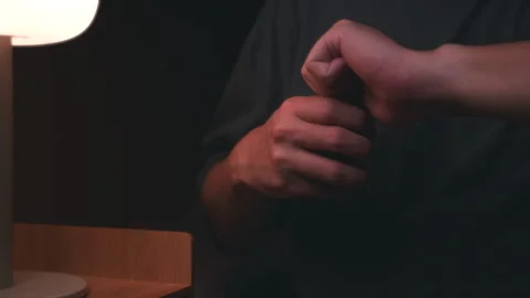 Close up of sick man taking medicine before sleeping at night in the bedroom. Video stock 266894432