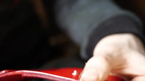 Close-up side angle of leather hand stitching Stock Footage 314962083