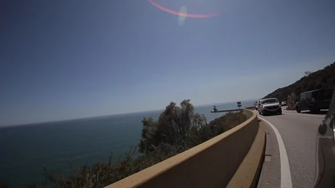 Close up side of car and light on the road. Driving car on the mountain road 库存影片 103322030