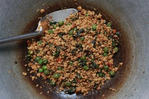 A close up of a side dish with stir-fried leunca and oncom Stock Photos